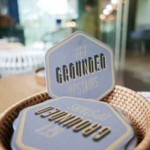 Grounded by CMCR coaster logo